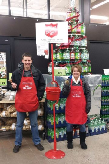 Two people ringing salvation army bells